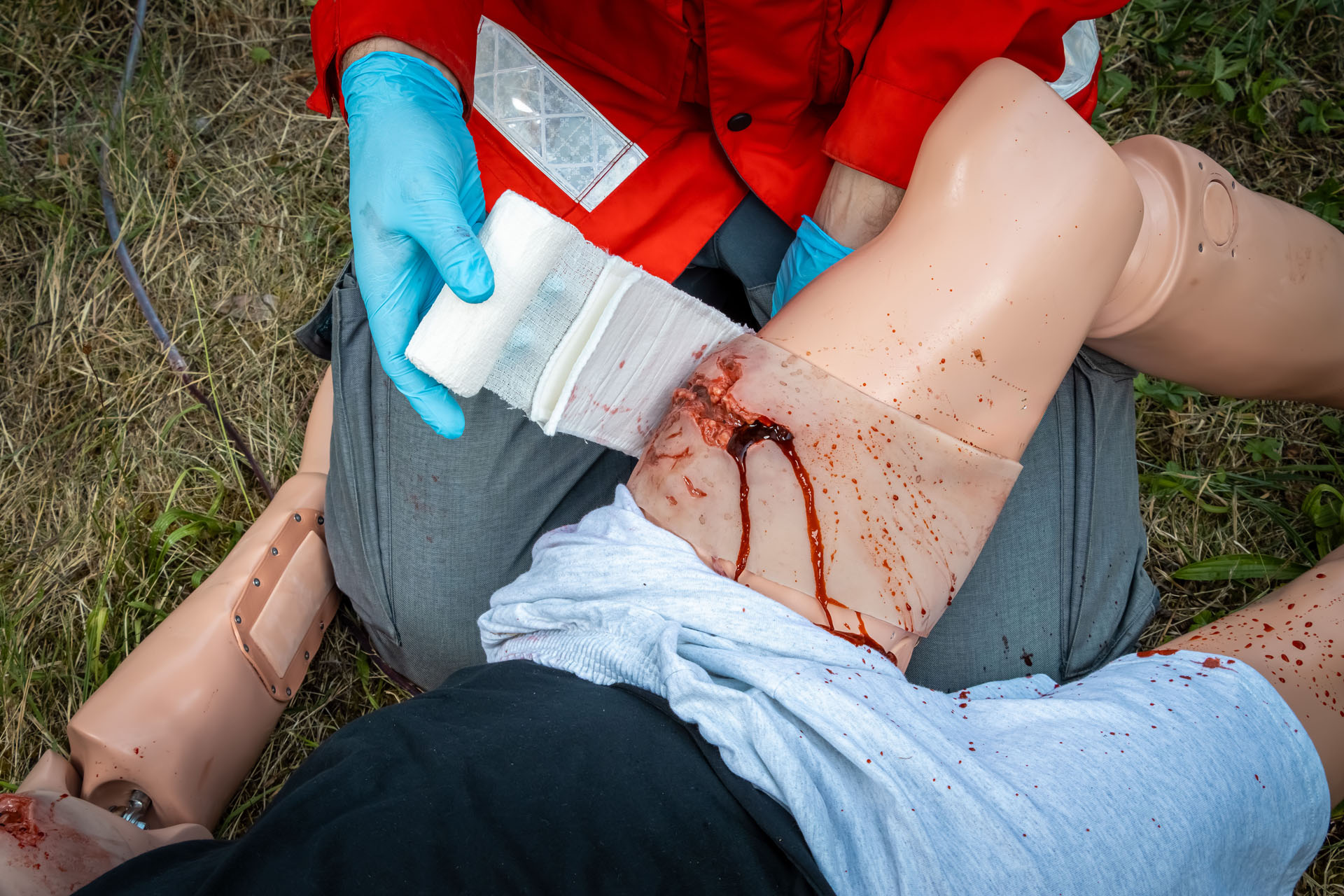 Wound Moulage Sleeve: Thigh Laceration with Bleeding Feature action